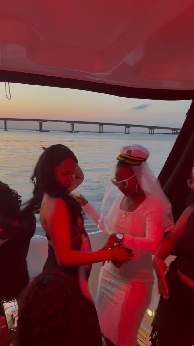 Bachelorette party dancing on the yacht at sunset