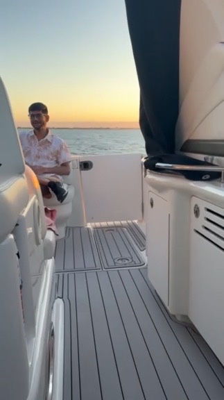 Guest relaxing on deck at sunset
