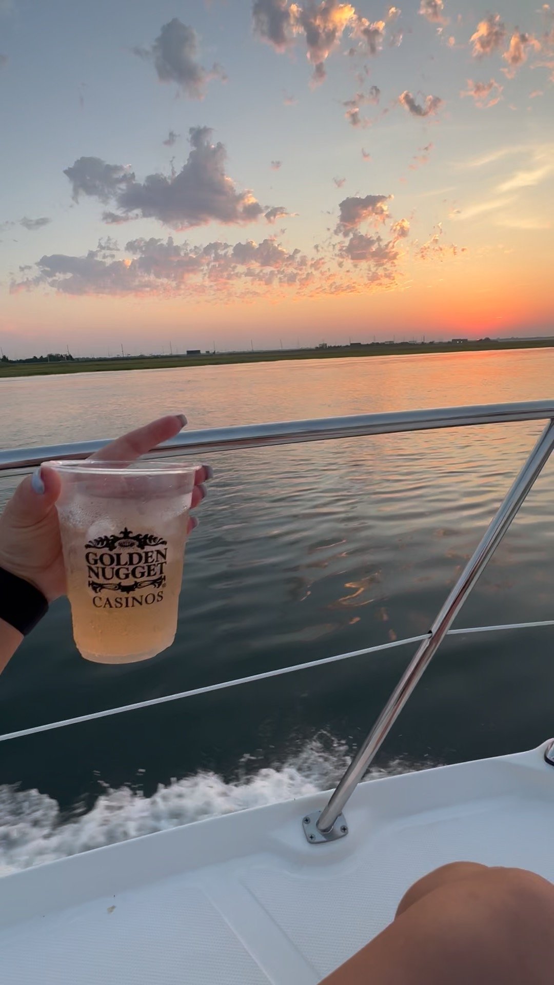 Guest enjoying drink at sunset