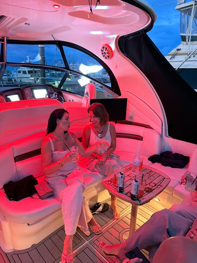 Guests relaxing in red LED-lit cockpit