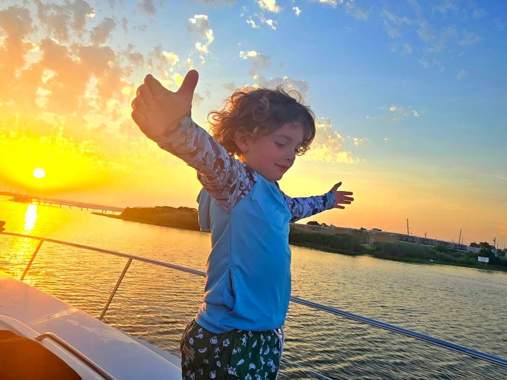 Guests enjoying sunset on deck
